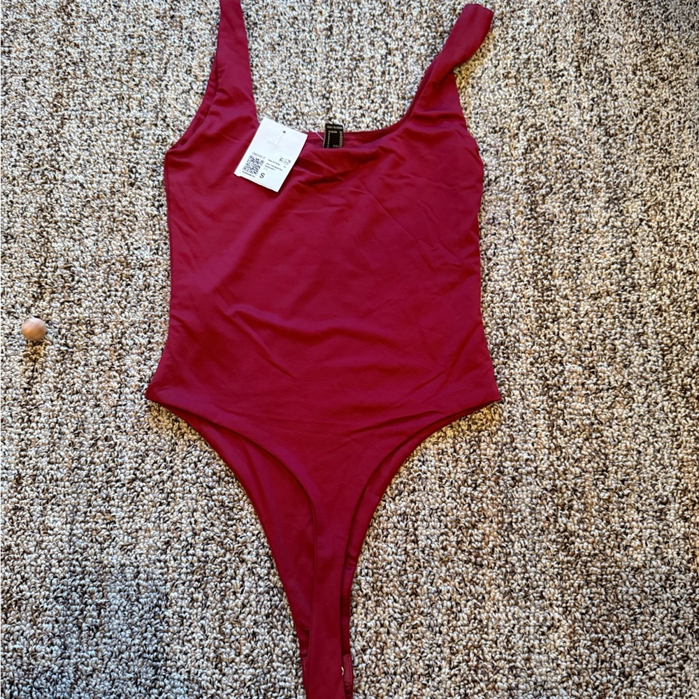 NWT. Forever 21 Burgundy Bodysuit with High-Cut Design